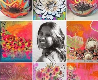 Bharathi Dev standing in front of one of her paintings